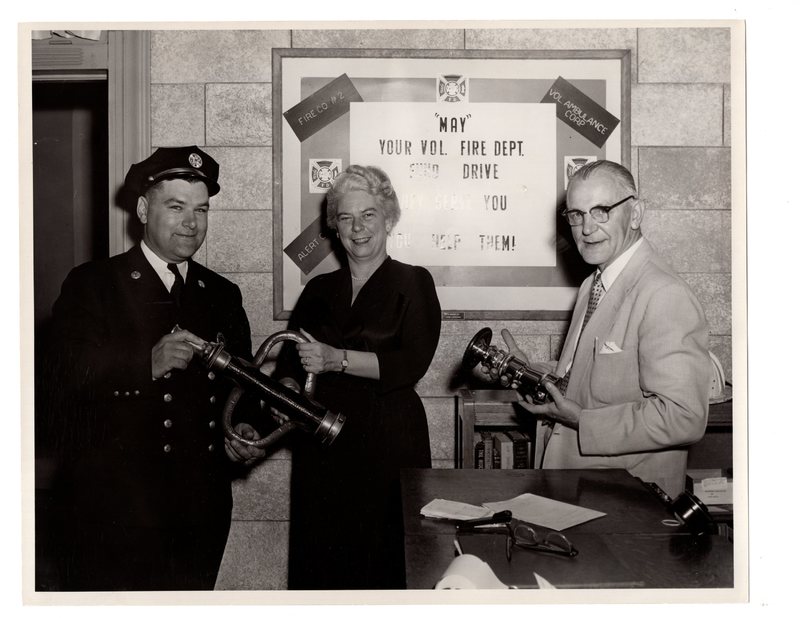1 black and white photograph (8 x 10) one member of the fire department and two volunteers, undated.jpg