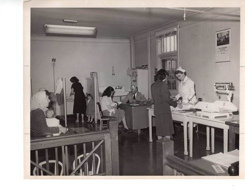 1 black and white photograph 8 x 10 Board of Health pictured Dr Lombar and public health Nurse Ruth Radcliffe providing care 1952.jpg