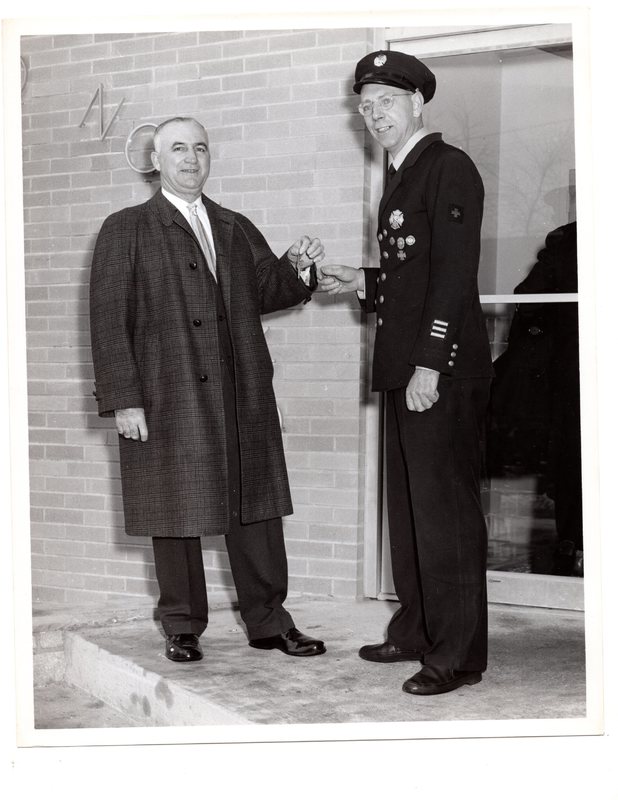 1 black and white photograph (8x10) George Rosein and contractor (Sirubi) in front of Alert Fire House, West Church Street, 1962.jpg