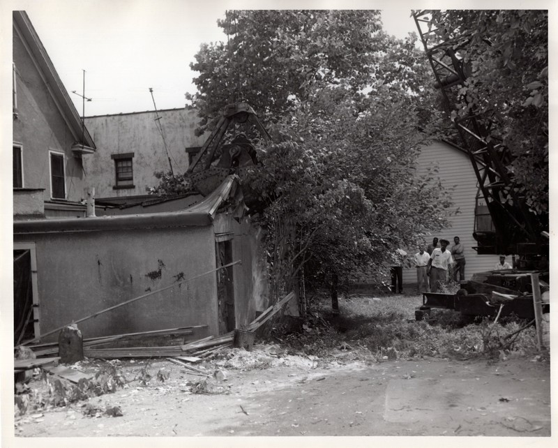 1 black and white photograph 8 x 10 Public Works Department tearing down home undated 1.jpg