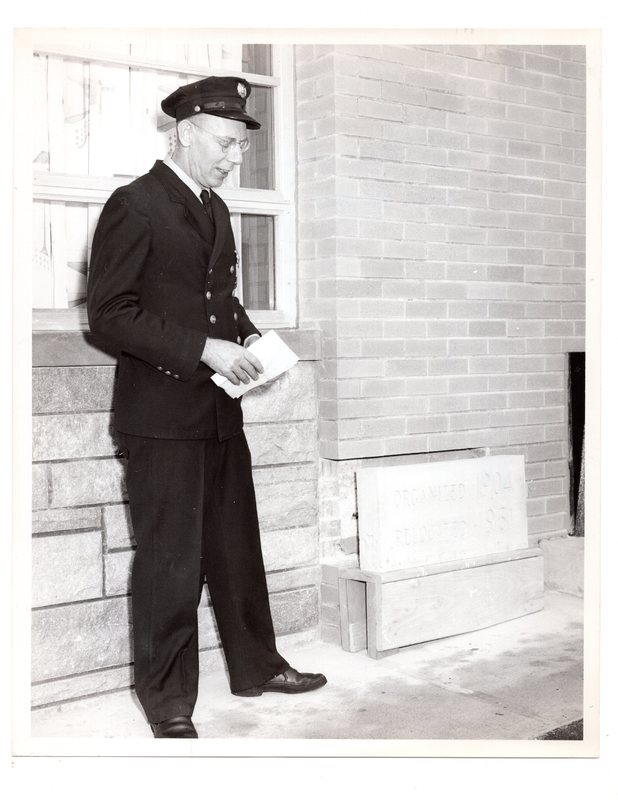 1 black and white photograph (8x10) George Rosein laying cornerstone of Alert Fire House, West Church Street, 1962.jpg