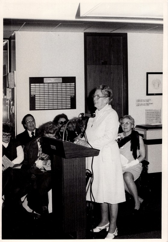 1 black and white photograph woman speaking at podium undated.jpg