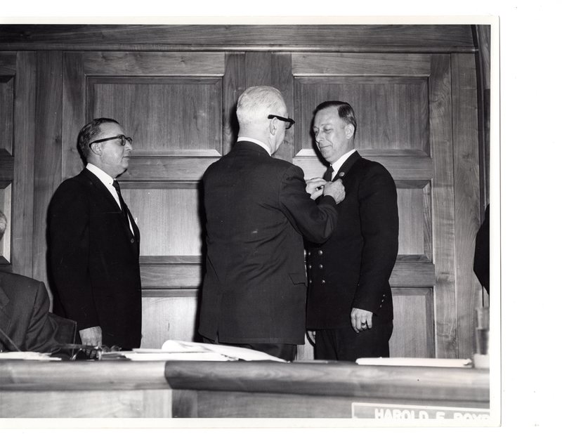 1 black and white photograph (8x10) member of the fire department and two Borough officials at Borough Hall, Jan. 1, 1962.jpg